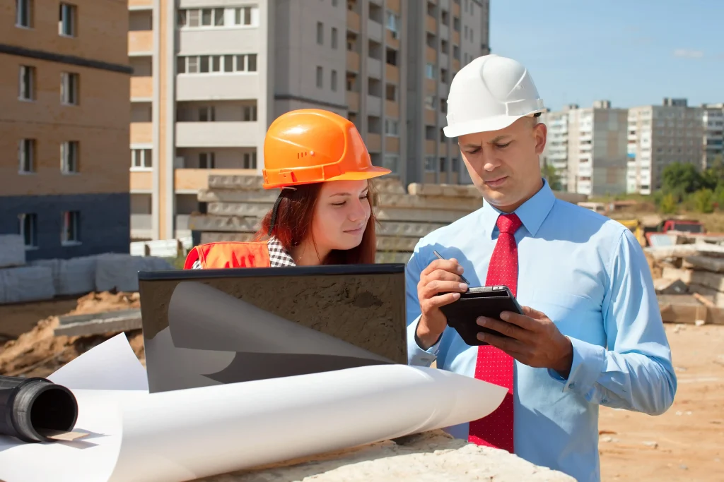 IoT sensors installed on construction equipment and structures transmitting real-time data to a digital monitoring dashboard.